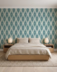 Desert Ritual Peacock tribal geometric wallpaper behind a low platform bed in a serene Japandi bedroom