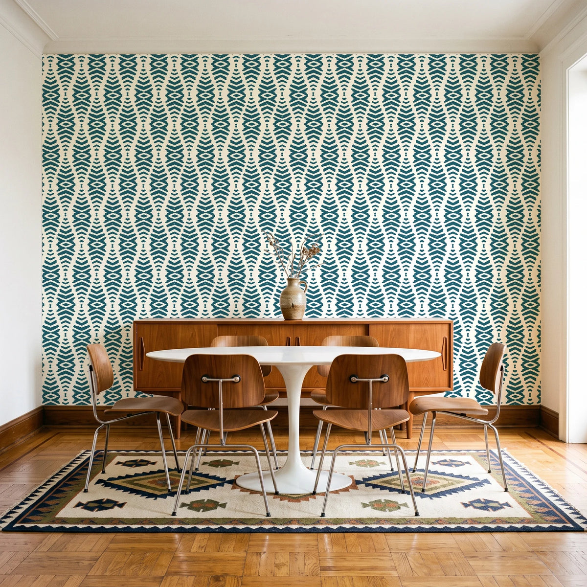 Desert Ritual Peacock tribal geometric wallpaper in a mid-century dining room with a teak sideboard and tulip table