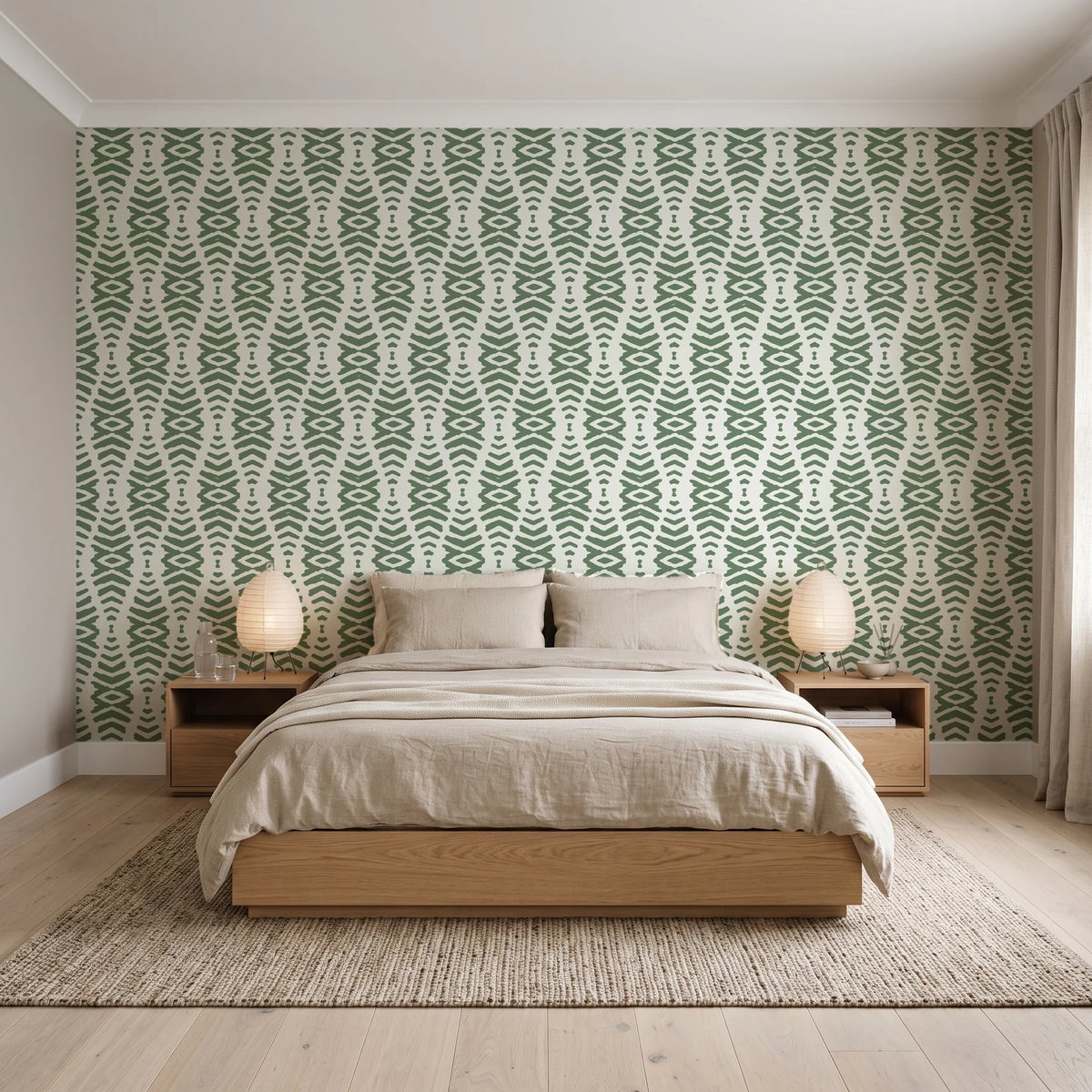 Desert Ritual Sage tribal geometric wallpaper behind a low platform bed in a serene Japandi bedroom