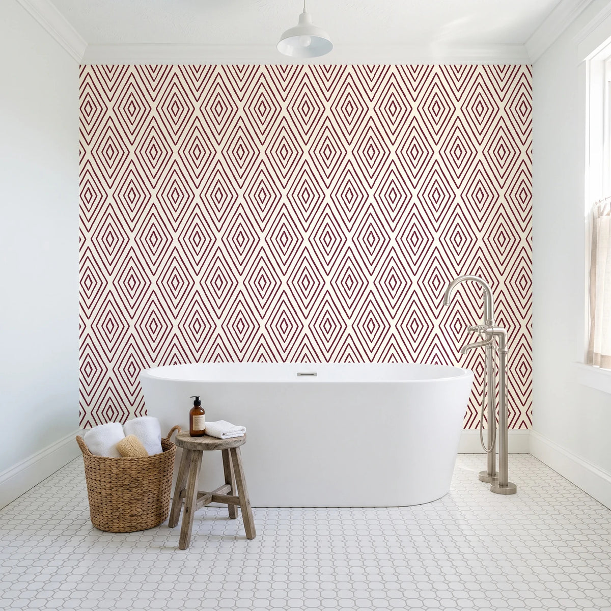 Diamond Echo Bordeaux tribal diamond wallpaper behind a freestanding tub in a bright coastal bathroom