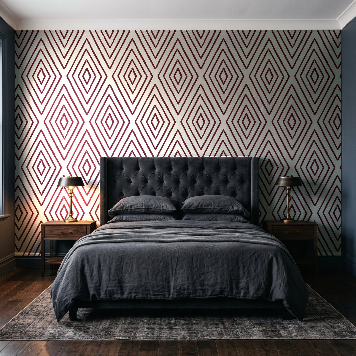 Diamond Echo Bordeaux tribal diamond wallpaper behind a tufted headboard in a dark, moody bedroom