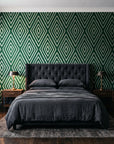 Diamond Echo Emerald tribal diamond wallpaper behind a tufted headboard in a dark, moody bedroom