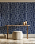 Diamond Echo Midnight tribal diamond wallpaper on the wall of a grand entry foyer