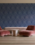 Diamond Echo Midnight tribal diamond wallpaper in a boutique hotel sitting area