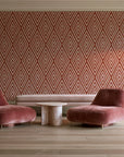 Diamond Echo Terracotta tribal diamond wallpaper in a boutique hotel sitting area