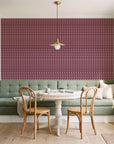 Dot Column Oxblood dotted wallpaper as a feature wall in a sunlit breakfast nook