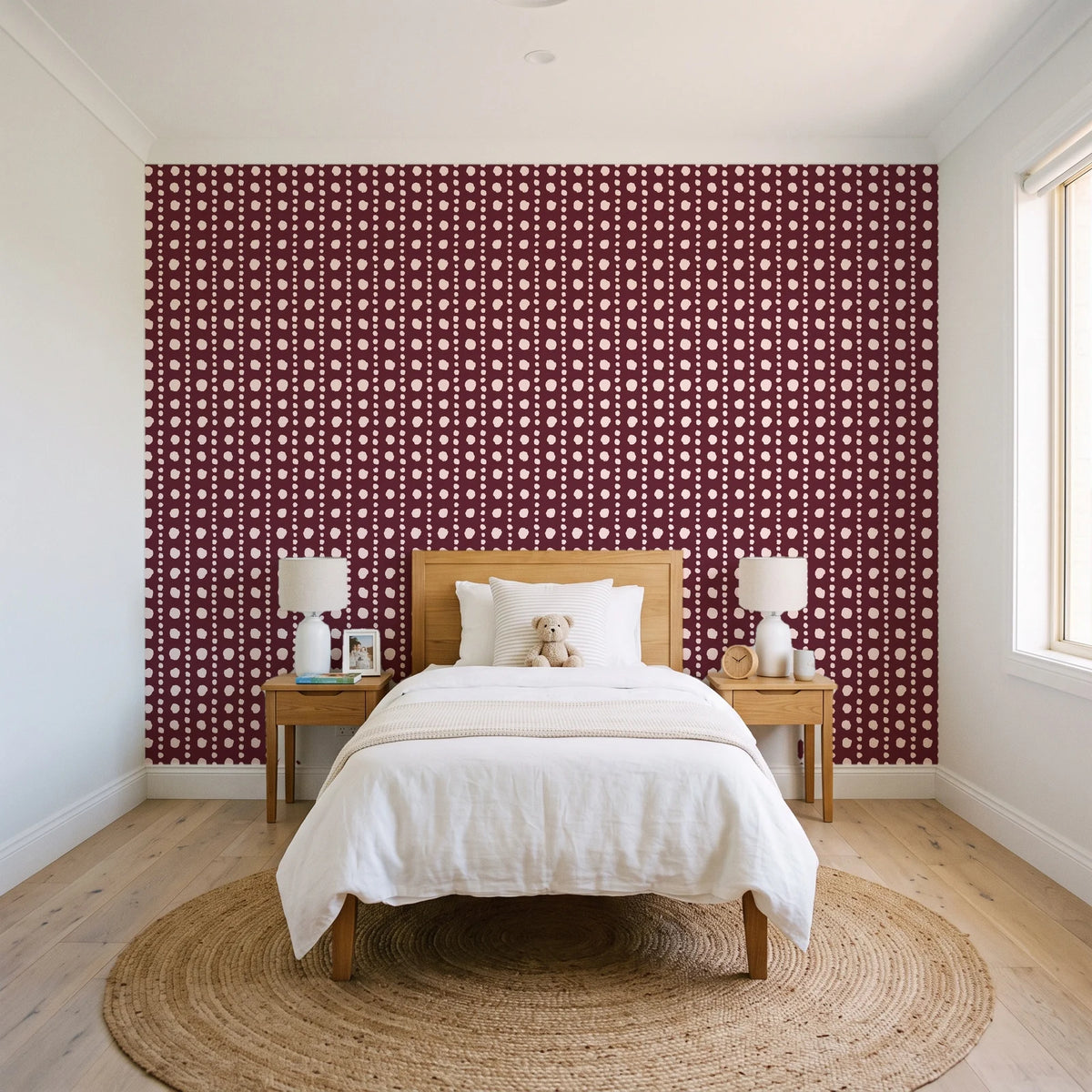 Dot Column Oxblood dotted wallpaper in a bright, cheerful child's bedroom