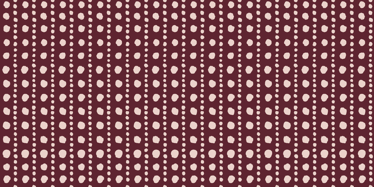 Dot Column Oxblood dotted wallpaper in oxblood and blush