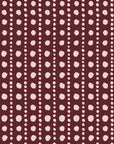 Dot Column Oxblood dotted wallpaper in oxblood and blush