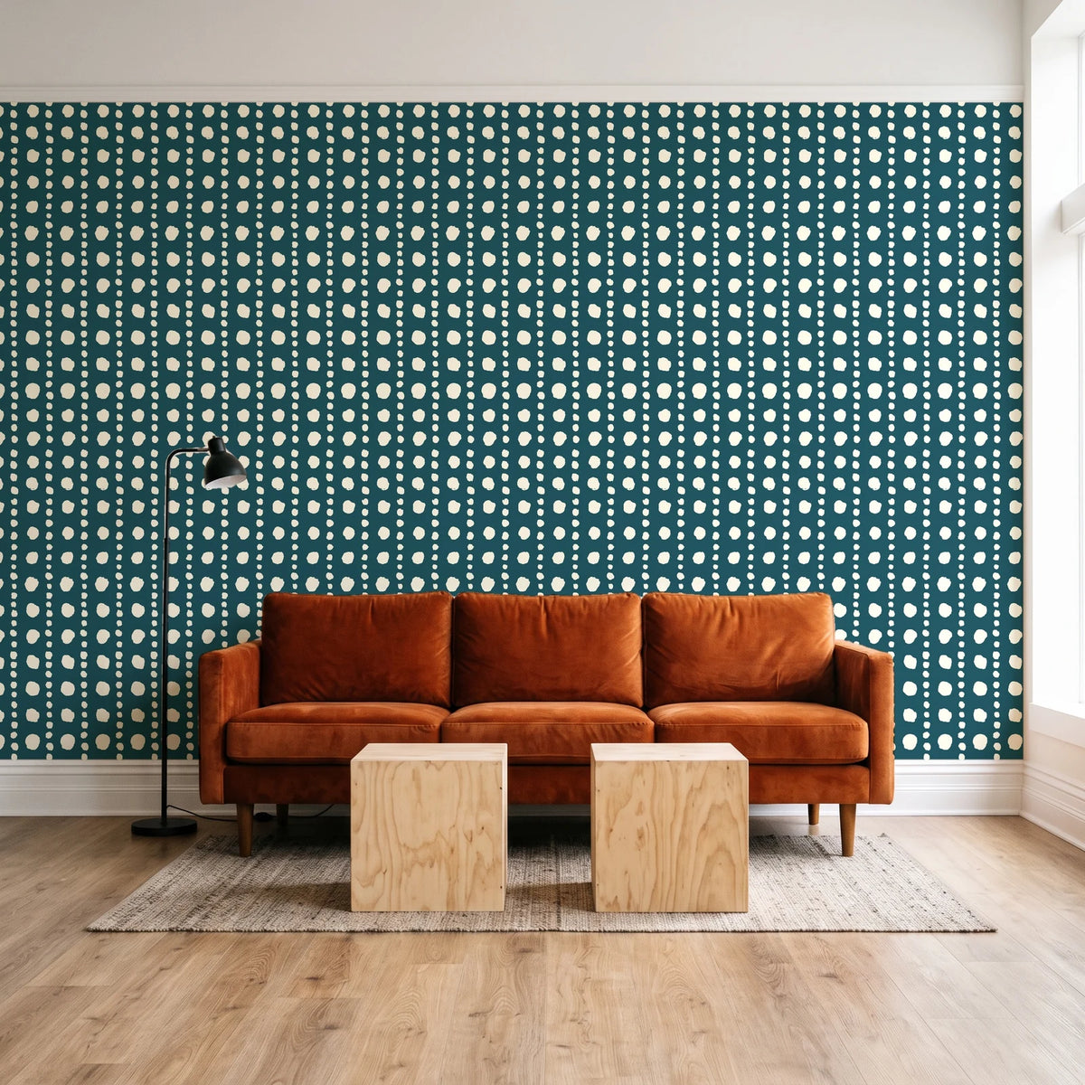 Dot Column Peacock dotted wallpaper behind a rust velvet sofa in a bright coworking lounge