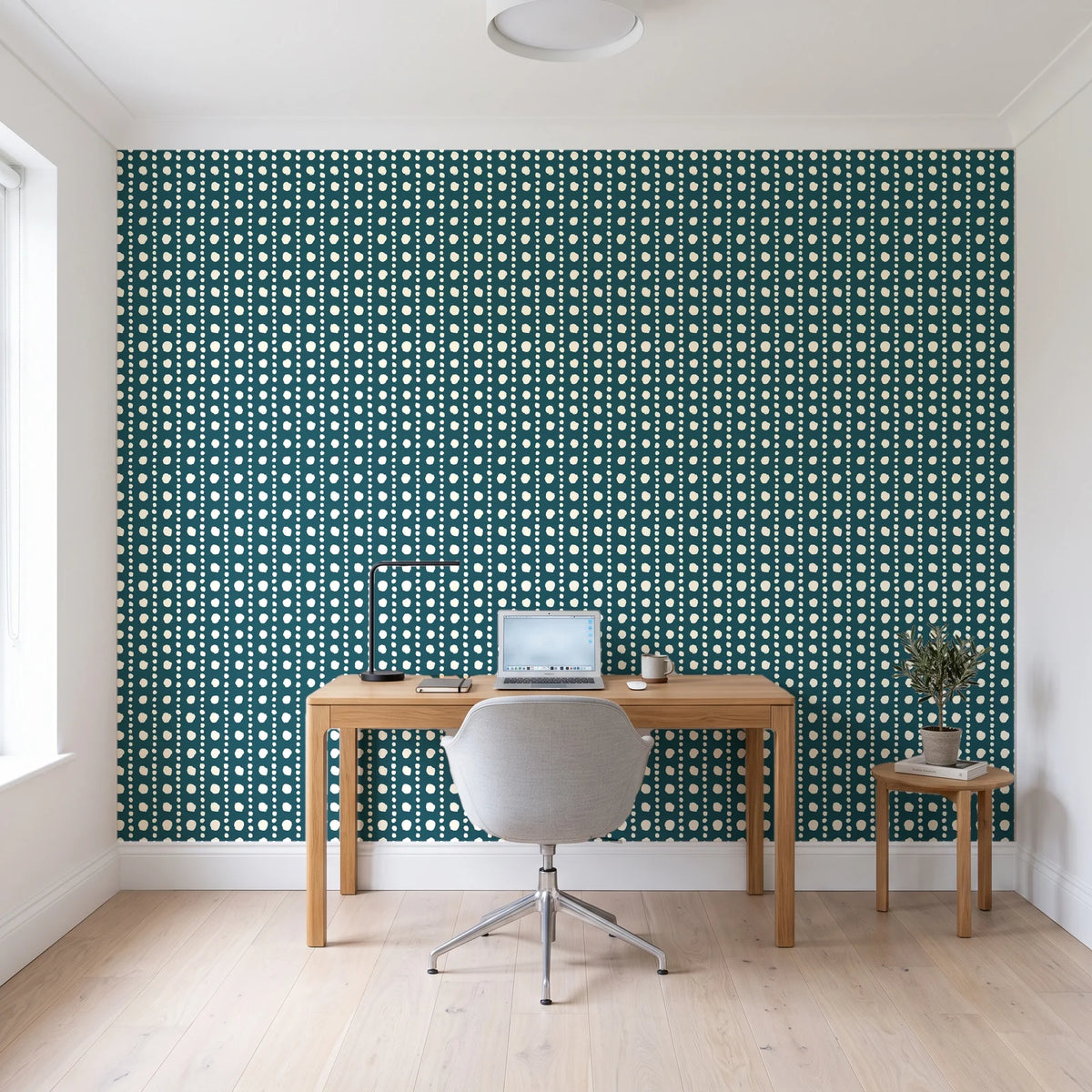 Dot Column Peacock dotted wallpaper behind a modern oak desk in a bright home office