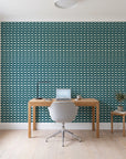 Dot Column Peacock dotted wallpaper behind a modern oak desk in a bright home office
