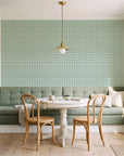 Dot Column Sage dotted wallpaper as a feature wall in a sunlit breakfast nook
