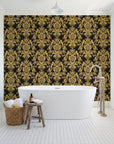 Dreamy Fern Dial Gilt fern damask wallpaper behind a freestanding tub in a bright coastal bathroom