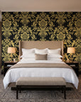 Dreamy Fern Dial Gilt fern damask wallpaper behind the headboard of a king bed in a contemporary hotel guest room