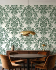 Dreamy Fern Dial Sage fern damask wallpaper behind a walnut credenza and round table in an elegant dining room
