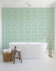 Drifting Petals Emerald abstract petal wallpaper behind a freestanding tub in a bright coastal bathroom