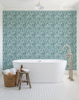 Drifting Petals Lagoon abstract petal wallpaper behind a freestanding tub in a bright coastal bathroom