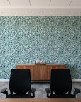Drifting Petals Lagoon abstract petal wallpaper above a walnut credenza in a modern conference room