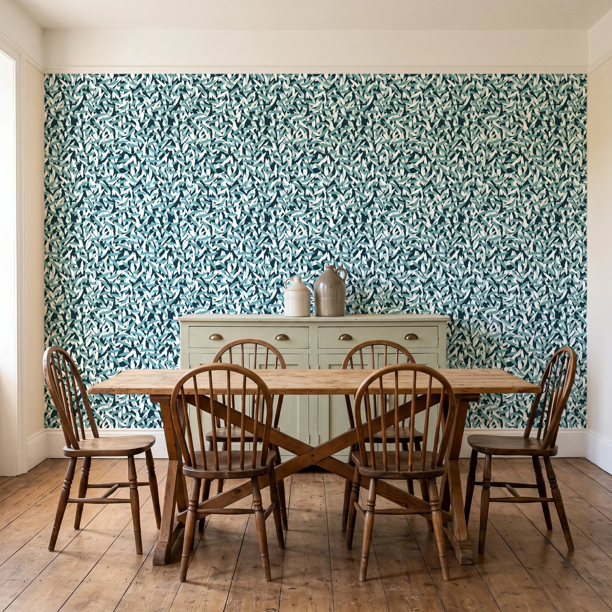 Drifting Petals Lagoon abstract petal wallpaper in a farmhouse dining room with a sage sideboard and rustic trestle table