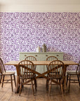 Drifting Petals Plum abstract petal wallpaper in a farmhouse dining room with a sage sideboard and rustic trestle table