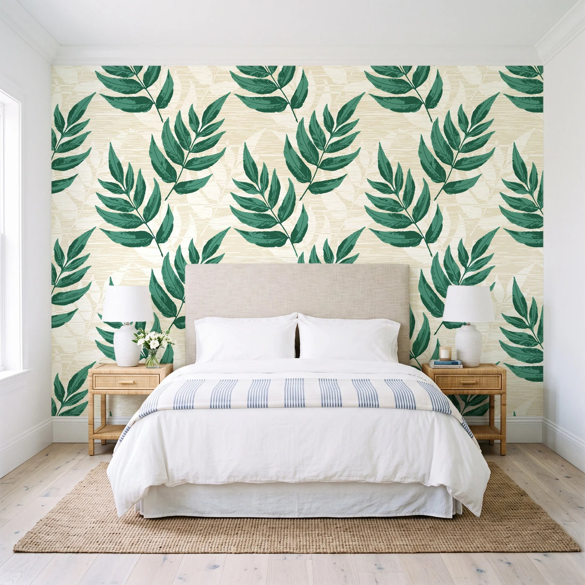 Driftwood Fern Emerald fern frond wallpaper behind a queen bed in a bright coastal bedroom