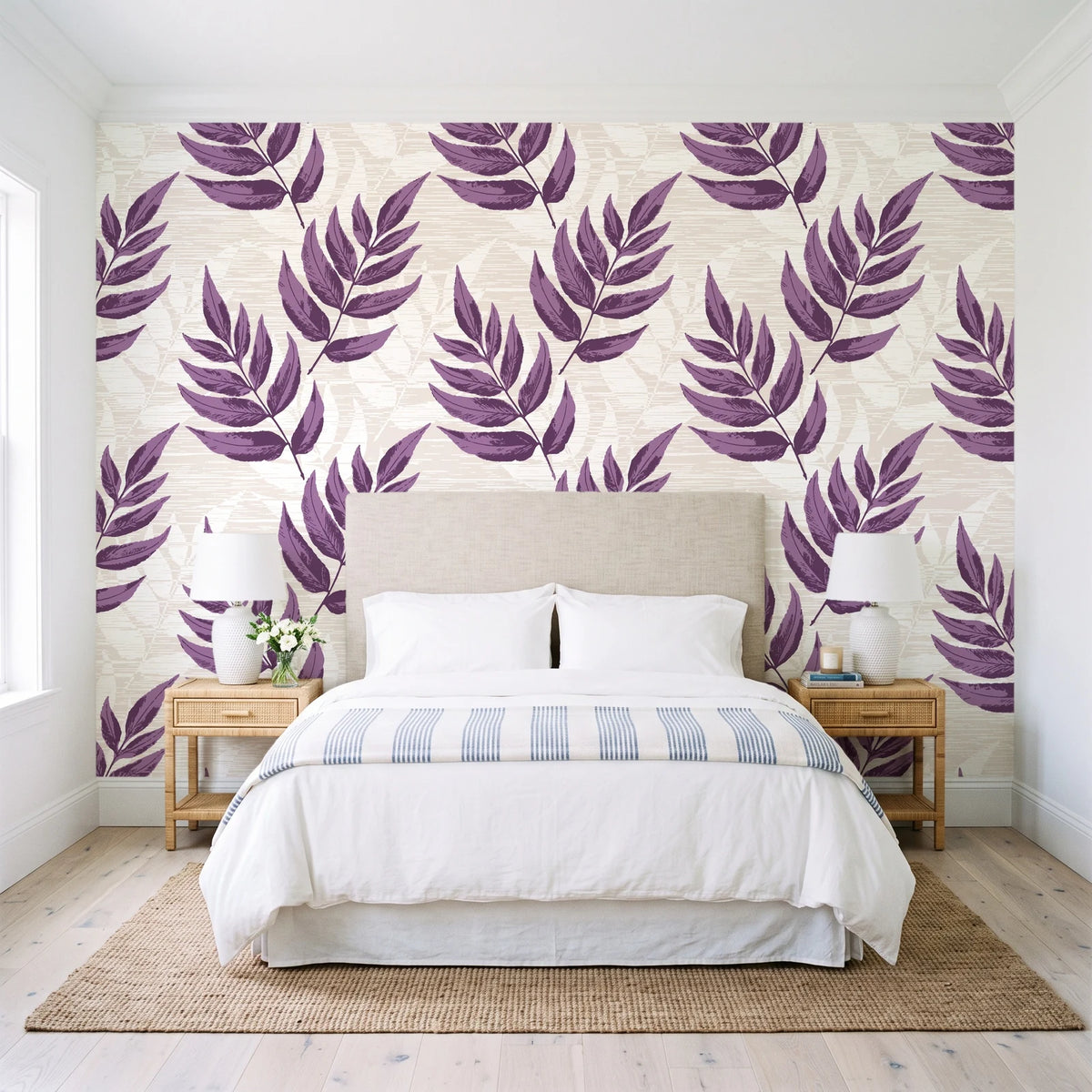 Driftwood Fern Plum fern frond wallpaper behind a queen bed in a bright coastal bedroom