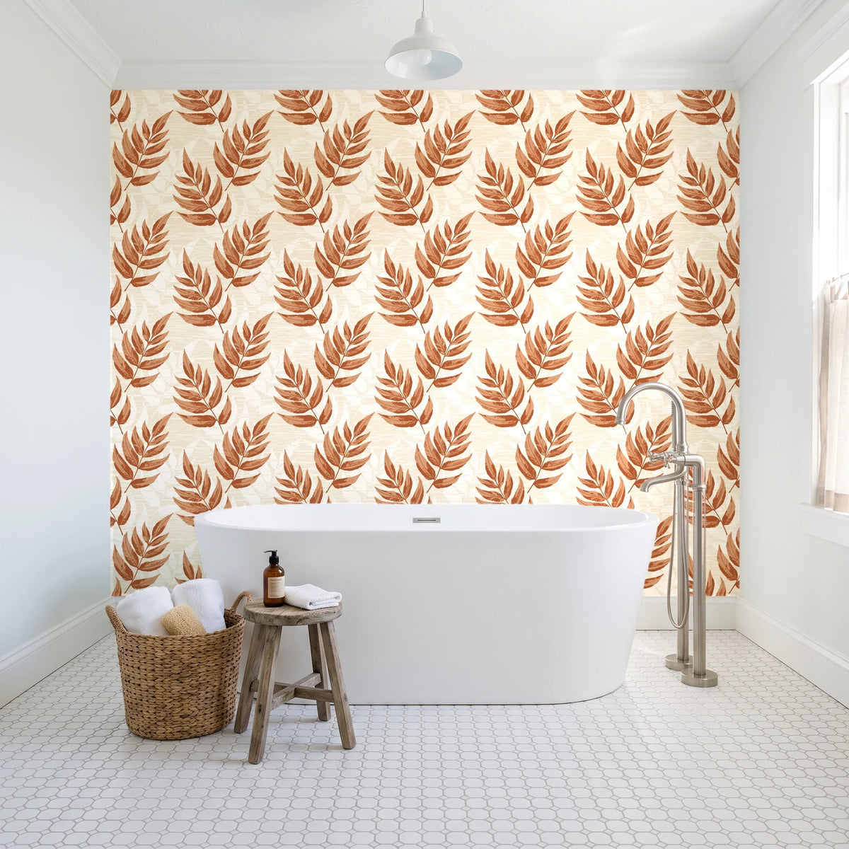 Driftwood Fern Terracotta fern frond wallpaper behind a freestanding tub in a bright coastal bathroom