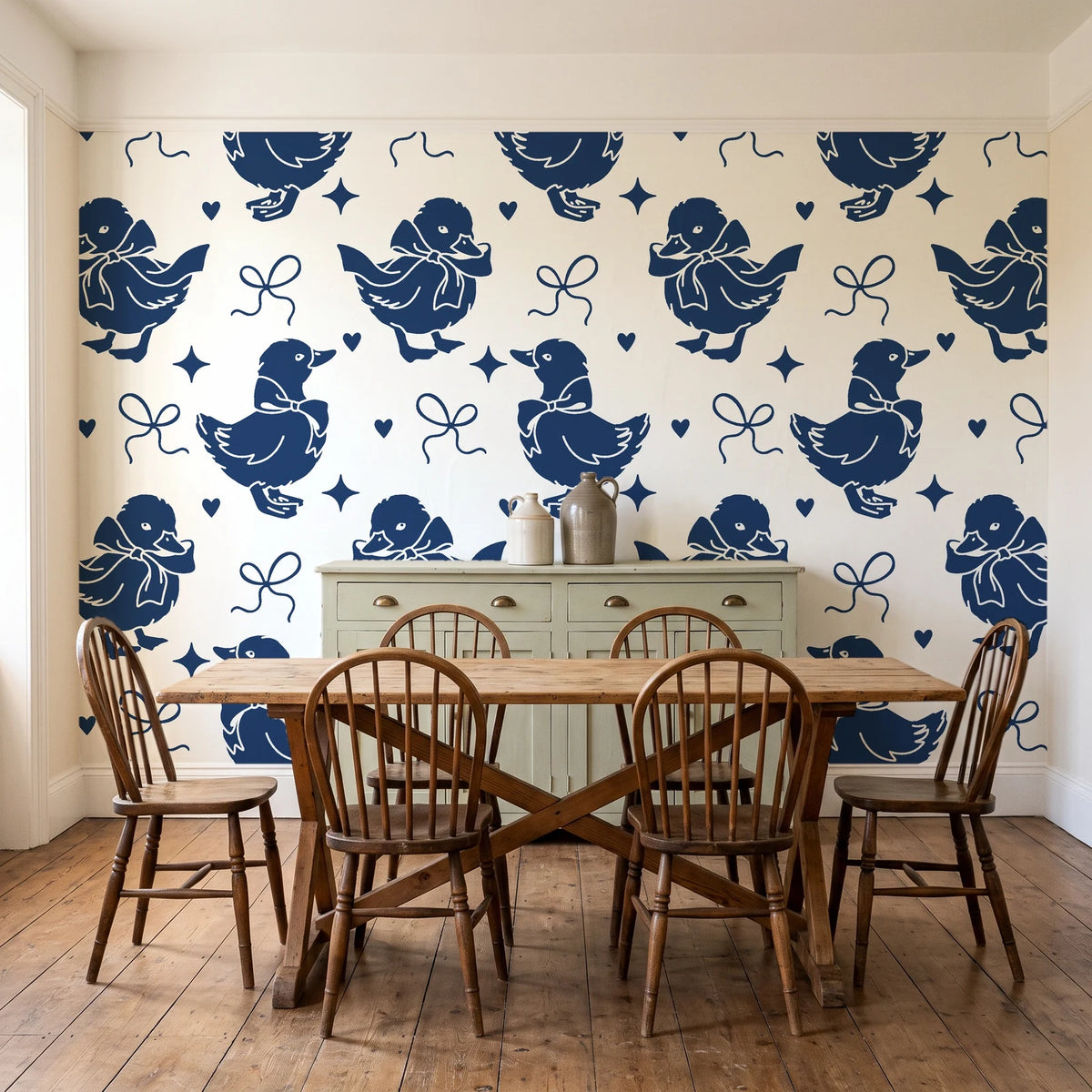 Duckling Waltz Navy ducklings wallpaper in a farmhouse dining room with a sage sideboard and rustic trestle table
