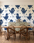 Duckling Waltz Navy ducklings wallpaper in a farmhouse dining room with a sage sideboard and rustic trestle table