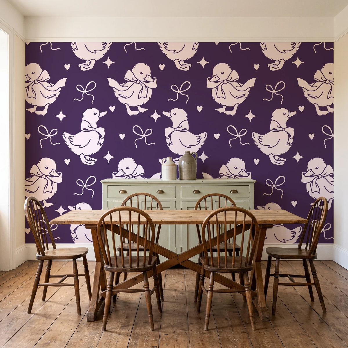 Duckling Waltz Plum ducklings wallpaper in a farmhouse dining room with a sage sideboard and rustic trestle table
