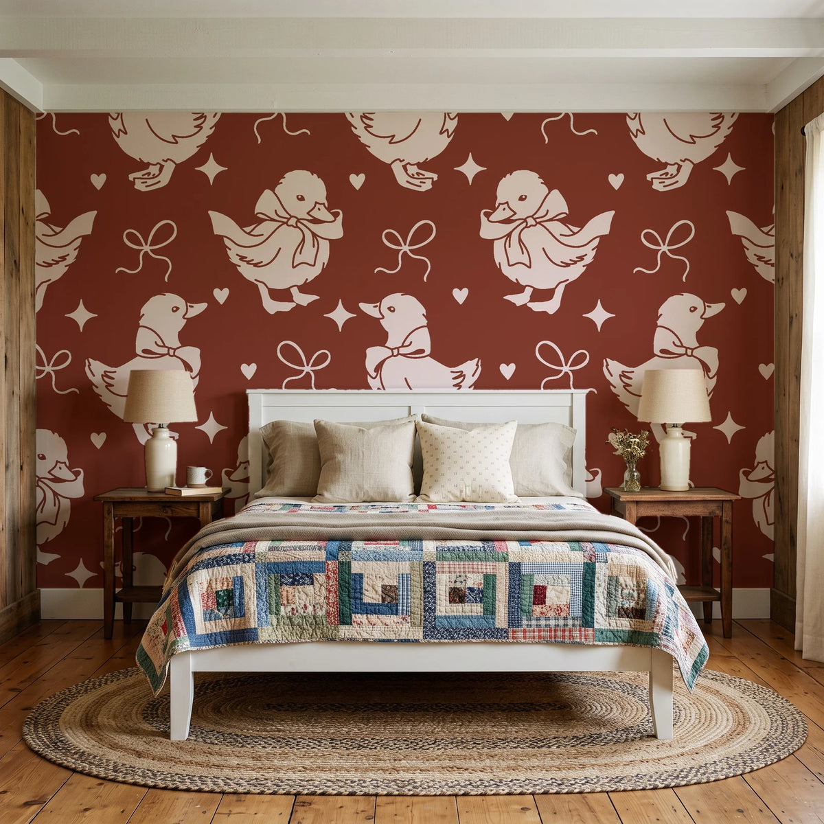 Duckling Waltz Rust ducklings wallpaper behind a white cottage bed with a patchwork quilt in a cozy cottagecore bedroom
