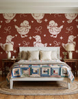 Duckling Waltz Rust ducklings wallpaper behind a white cottage bed with a patchwork quilt in a cozy cottagecore bedroom