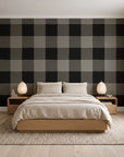 Dune Plaid Charcoal gingham check wallpaper behind a low platform bed in a serene Japandi bedroom