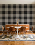 Dune Plaid Charcoal gingham check wallpaper in a mid-century dining room with a teak sideboard and tulip table