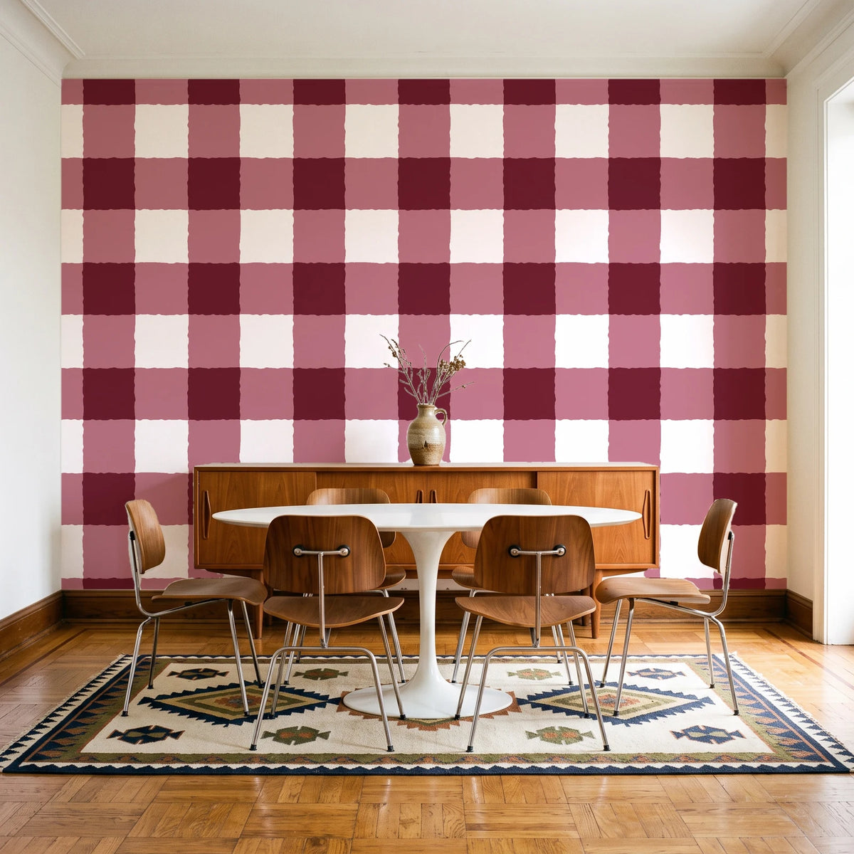 Dune Plaid Oxblood gingham check wallpaper in a mid-century dining room with a teak sideboard and tulip table