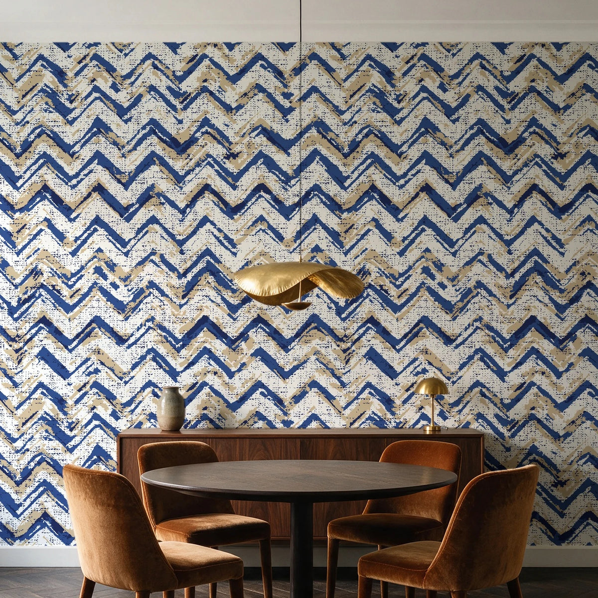 Dusk Passage Indigo chevron wallpaper behind a walnut credenza and round table in an elegant dining room