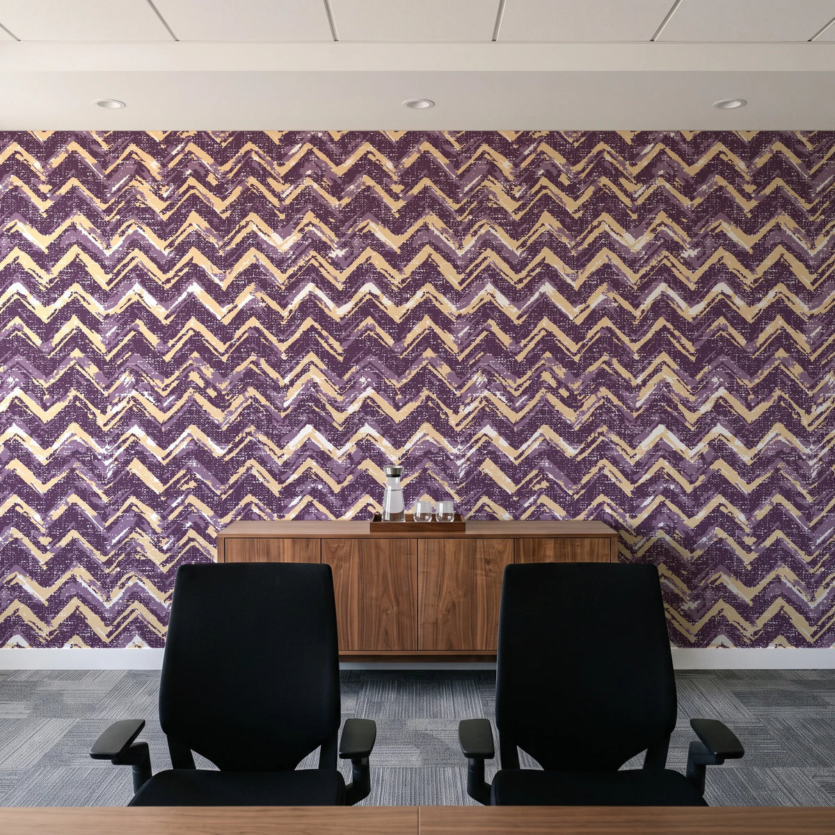Dusk Passage Plum chevron wallpaper above a walnut credenza in a modern conference room
