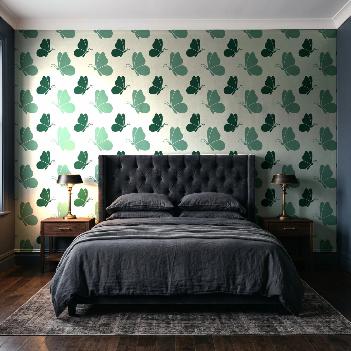 Dust & Wing Emerald butterflies wallpaper behind a tufted headboard in a dark, moody bedroom