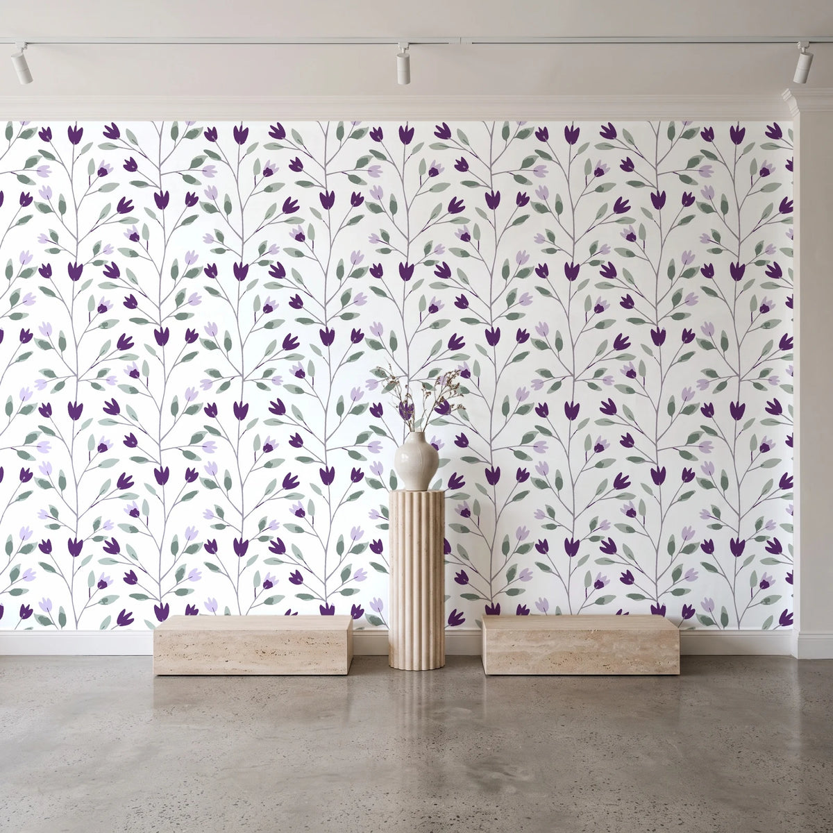Ember & Leaf Aubergine botanical floral wallpaper behind a travertine pedestal and vase in a minimal boutique