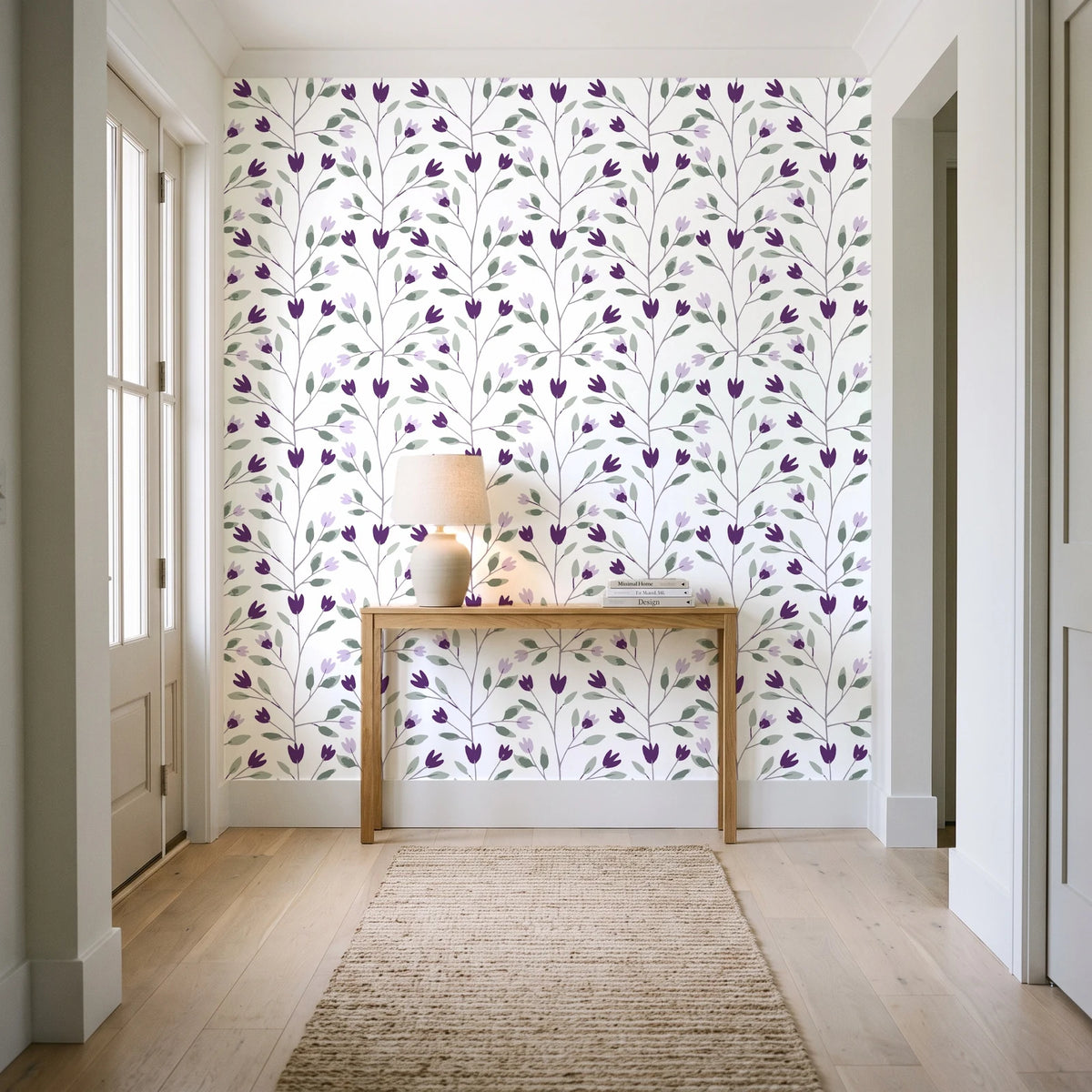 Ember & Leaf Aubergine botanical floral wallpaper behind a console table in a light entry hallway