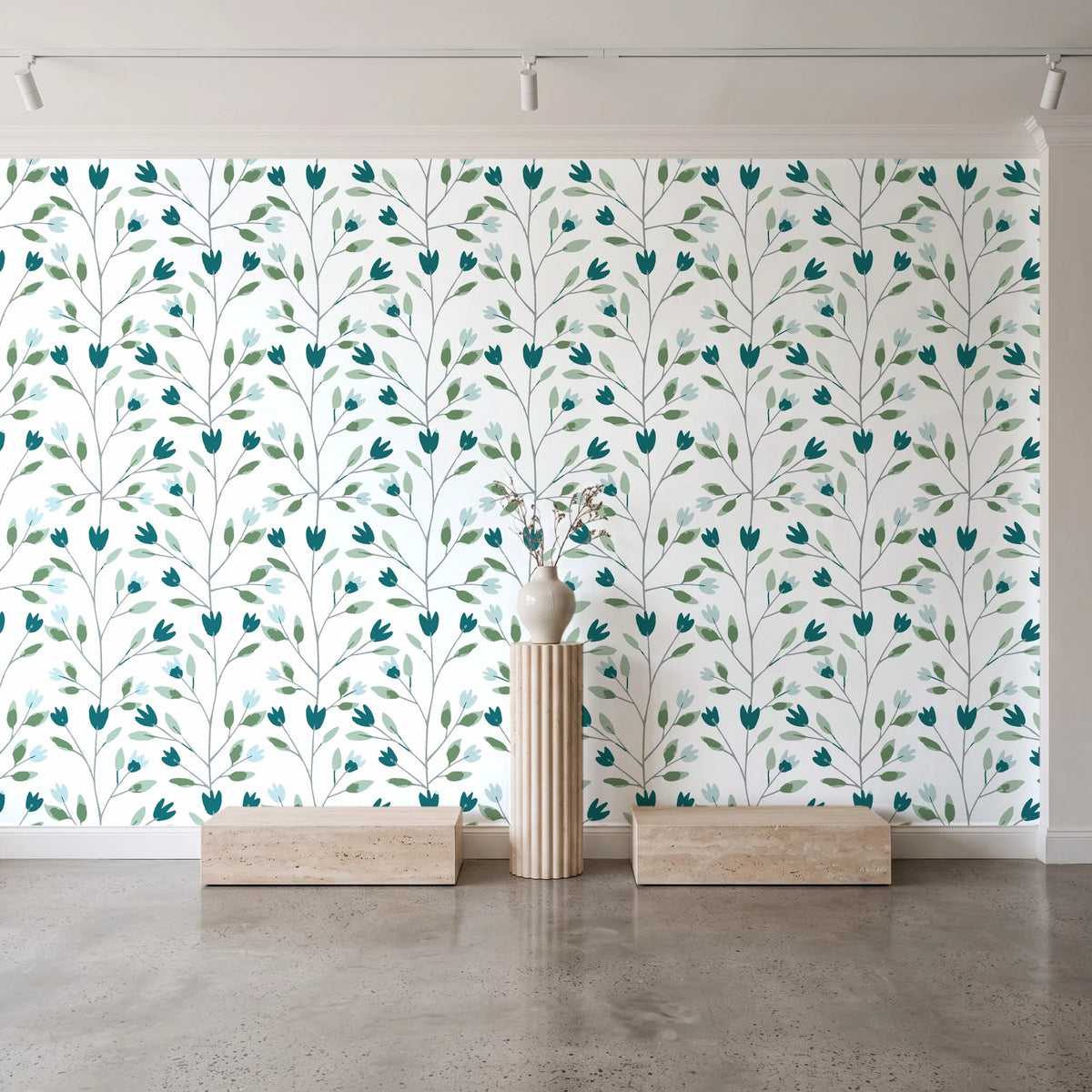Ember & Leaf Peacock botanical floral wallpaper behind a travertine pedestal and vase in a minimal boutique