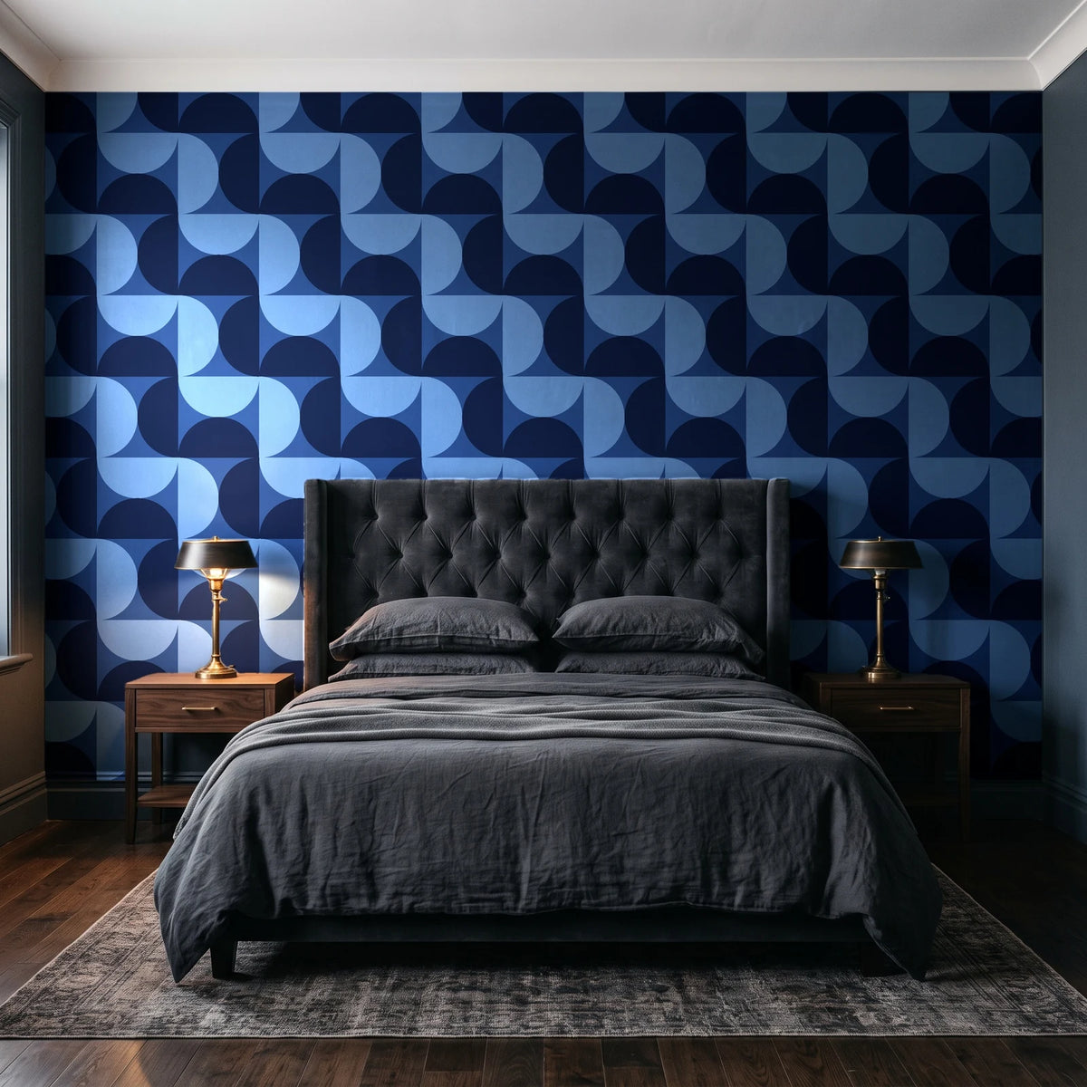 Ember Mosaic Midnight retro geometric wallpaper behind a tufted headboard in a dark, moody bedroom