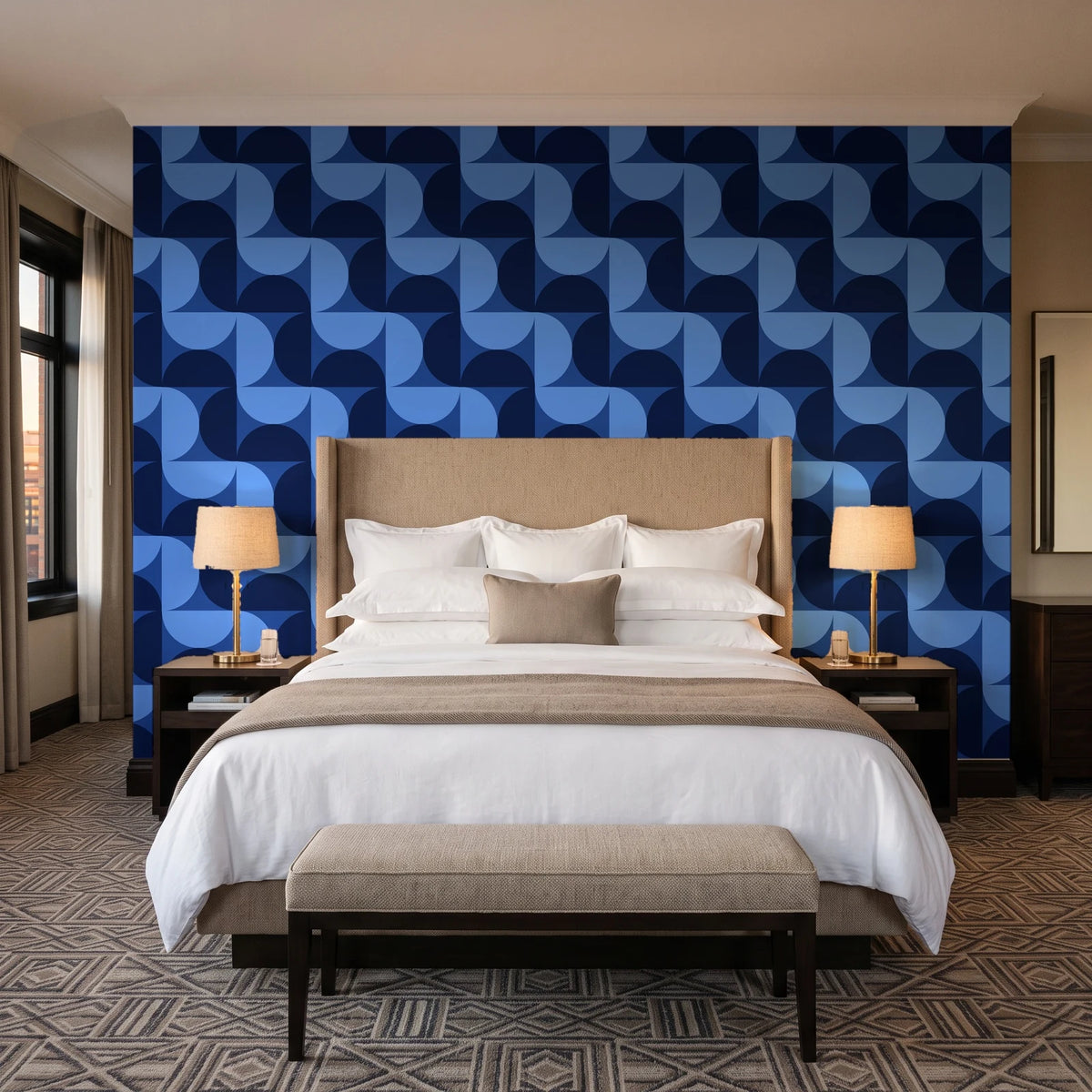 Ember Mosaic Midnight retro geometric wallpaper behind the headboard of a king bed in a contemporary hotel guest room