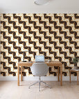 Ember Mosaic Mocha retro geometric wallpaper behind a modern oak desk in a bright home office