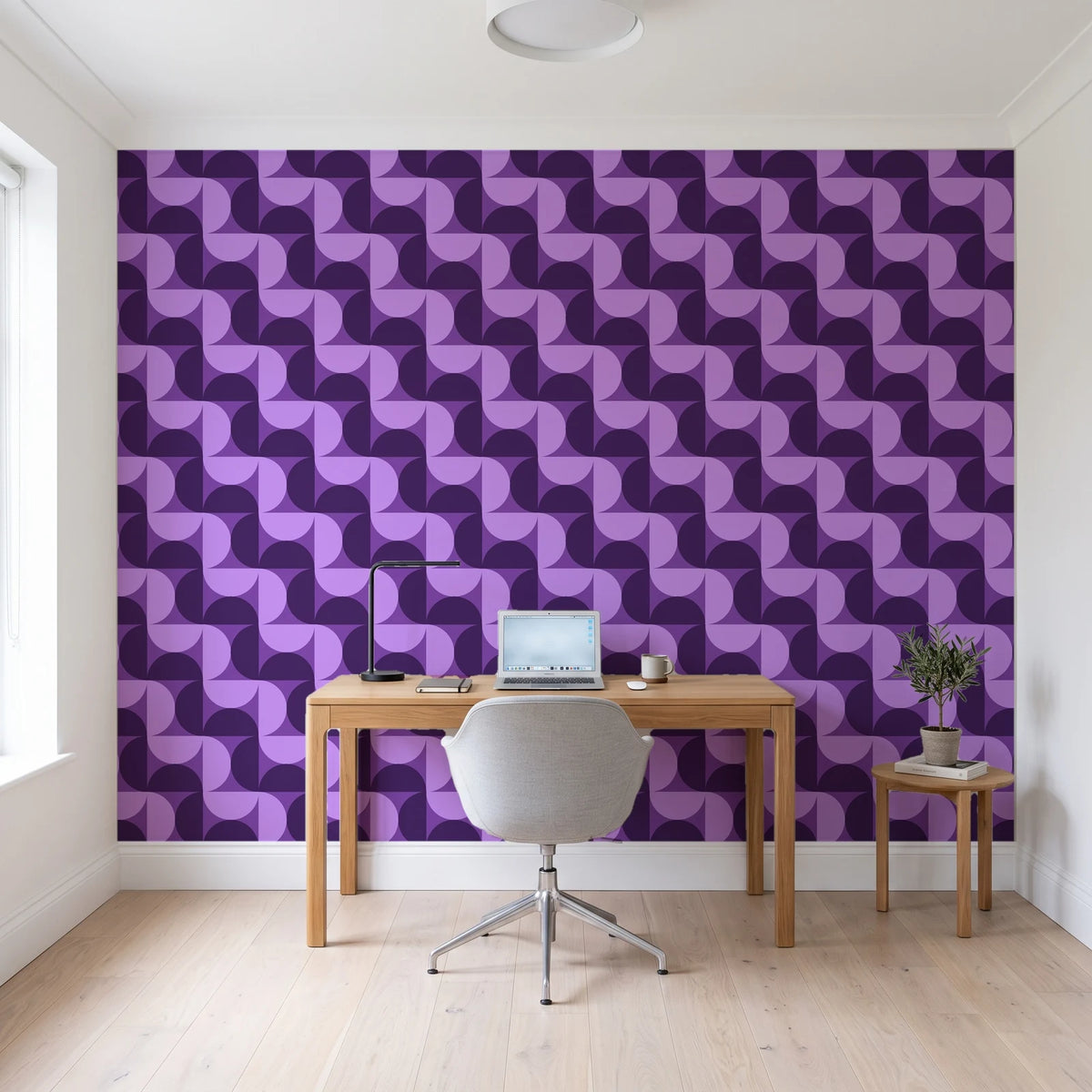 Ember Mosaic Plum retro geometric wallpaper behind a modern oak desk in a bright home office
