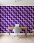 Ember Mosaic Plum retro geometric wallpaper behind a modern oak desk in a bright home office