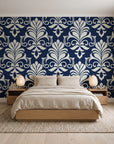 Ethereal Flowers Midnight damask wallpaper behind a low platform bed in a serene Japandi bedroom