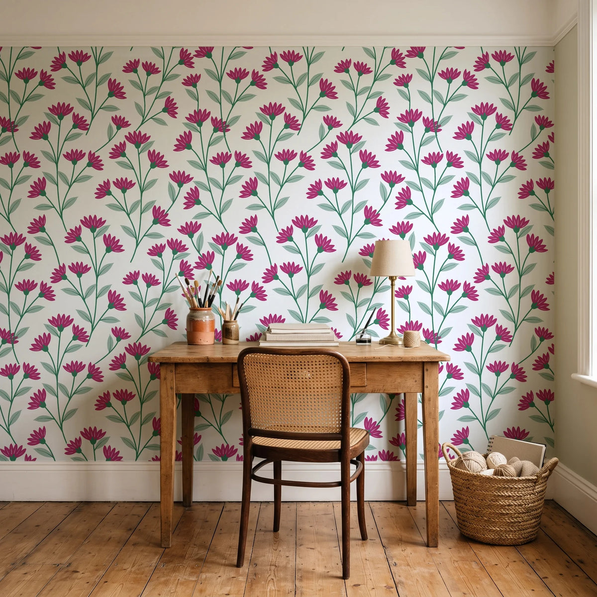 Evening Garden Linen botanical floral wallpaper behind a vintage writing desk in a cozy craft-room home office