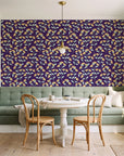 Evening Garden Plum botanical floral wallpaper as a feature wall in a sunlit breakfast nook